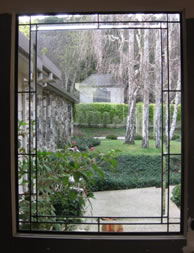Bevels frame a quiet backyard view